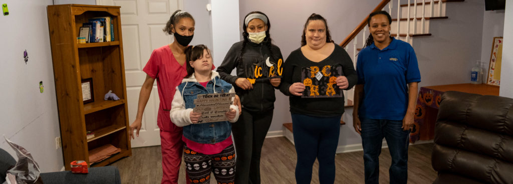 A direct care health aide helping a patient.
